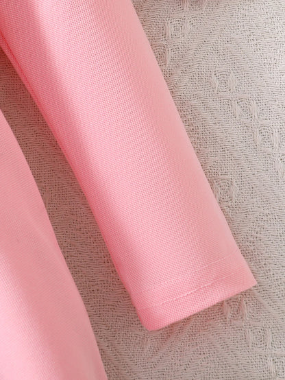 Close-up of the pink dress sleeve and stitched cuff